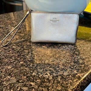 Coach Wristlet in Gold. Brand new and never been used.